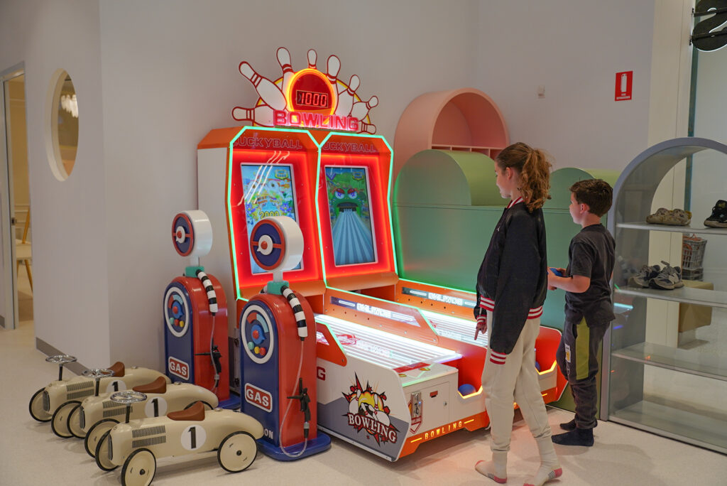 Two children playing arcade games at Little Amigos Penrith