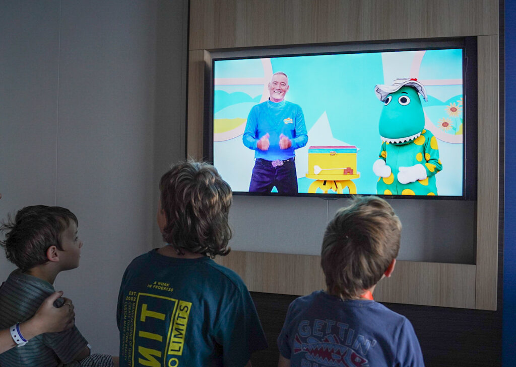 Kids watching Wiggles from our stateroom on Ovation of the Seas